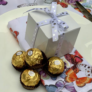 white cube box filled with Ferrero Rocher Chocolates
